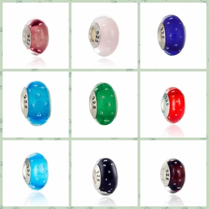 Macro view of 925 silver core bubble glass charms in nine sweet candy colors