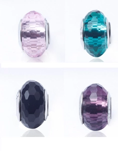 Macro detail of faceted crystal beads with 925 sterling silver cores in four colors