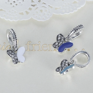 Detail of DIY butterfly pendants with crystal rhinestones and colorful enamel inlay