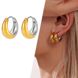 Two-tone gold and silver huggie earrings with matte and polished finish design