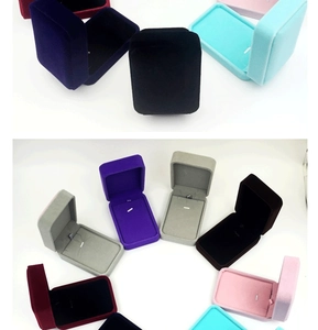 Detailed view of various velvet jewelry boxes in multiple colors for necklaces and pendants