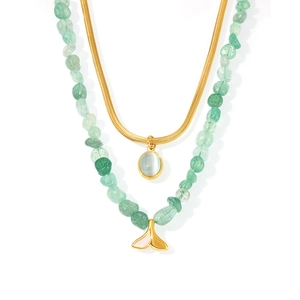 Double-layered necklace with green natural stone beads and gold fishtail pendant