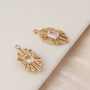 Macro detail of gold-plated geometric cross pendant with inlaid zircon for DIY jewelry