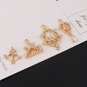 DIY jewelry accessories set featuring golden castle and bow pendants with sparkling zircons