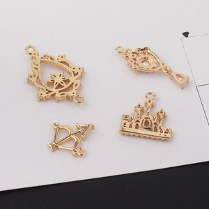 Golden DIY jewelry pendants set featuring castle, bow, and rhinestone frame designs