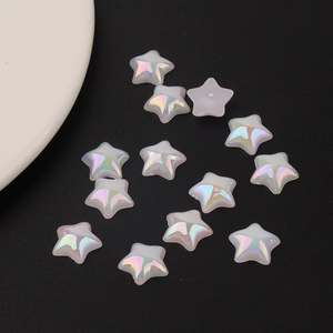 Macro shot of iridescent mermaid pearl star flatback beads for DIY resin crafts