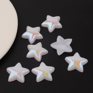 Macro shot of seven Aurora pearlescent star-shaped acrylic beads for DIY crafting
