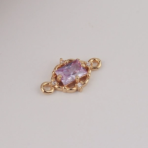 Macro shot of gold-plated rectangular purple zircon charm with dual-link hanging rings