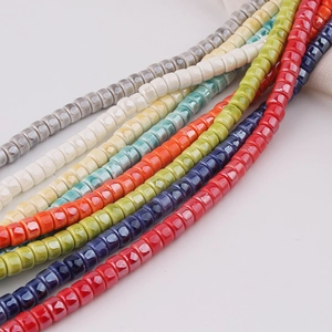 Macro shot of colorful glazed ceramic square beads for DIY jewelry and necklaces