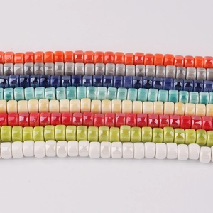 Macro shot of colorful ceramic spacer beads with polished glazed finish for DIY jewelry