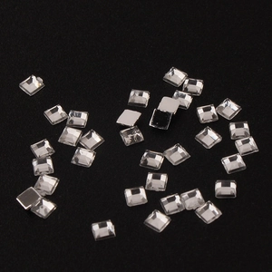 Macro view of 2mm square acrylic flatback rhinestones for nail art and DIY decor