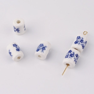 Macro detail of blue and white cylindrical ceramic beads for DIY jewelry making