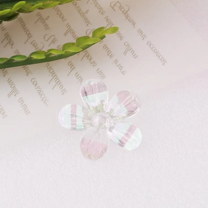 Macro shot of an iridescent resin flower bead with pearlescent finish for DIY crafting