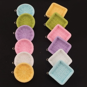 Miniature woven basket charms in assorted macaron colors with metal ring detail