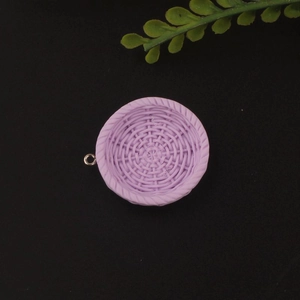 Detail showing small purple resin basket charm for DIY jewelry making and handmade crafts