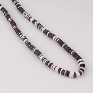 Detailed view of colorful mixed polymer clay heishi beads for DIY jewelry making