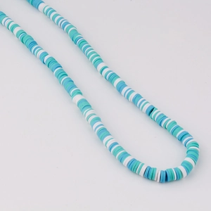 Detail of blue and white mixed polymer clay heishi beads for DIY jewelry making