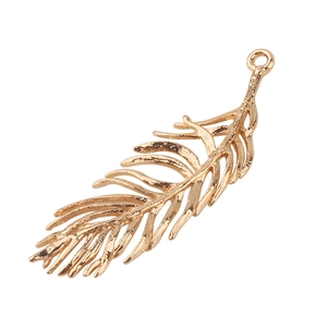 Golden feather pendant in metal alloy for DIY jewelry making on white background
