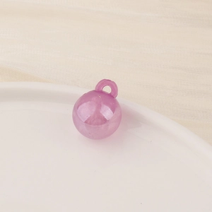 Close-up of a translucent light purple round bead with a hanging hole on white ceramic