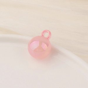 Detailed view of pink candy-colored pearl luster round bead with hoop for DIY crafts