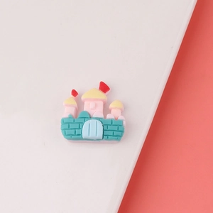 Detailed view of colorful resin castle charms for DIY handmade hair clips and crafts