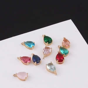 Macro detail of colorful pear-cut crystal pendants with gold-plated metal settings