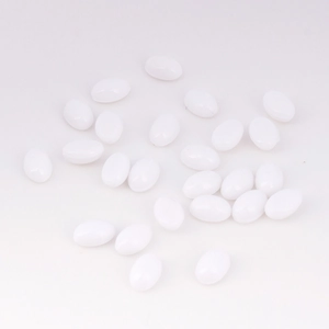 Macro view of 4x6mm white acrylic oval flatback rhinestones for DIY crafts and jewelry