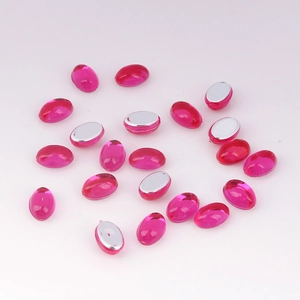 Macro detail of oval pink acrylic flatback rhinestones for DIY crafts and jewelry