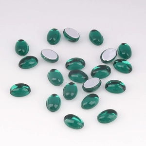 Macro view of 4x6mm emerald green oval acrylic rhinestones for DIY jewelry crafts