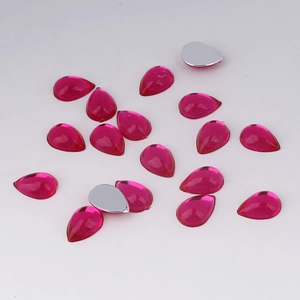 Macro view of 7x10mm rose red acrylic teardrop rhinestones with silver foil flat back