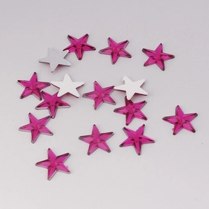 Macro shot of 10mm dark pink faceted acrylic star rhinestones with silver flat back base
