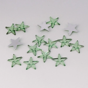 Detail of 10mm light green acrylic star rhinestones with faceted surface and flat back base