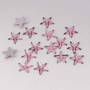 Macro detail of 10mm pink star-shaped acrylic rhinestones for DIY crafts and nail art decoration
