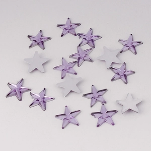 Macro detail of 10mm light purple acrylic star rhinestones with flat back design