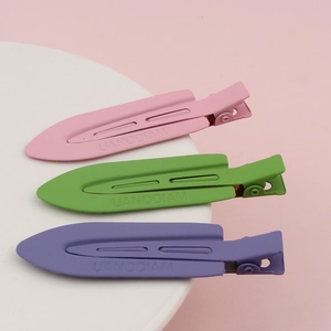 Three matte pastel seamless hair clips in pink, green, and purple metal alloy set