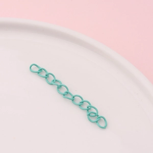 Detail view of mint green matte extension chain for DIY jewelry making and bag accessories