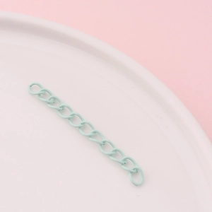 Detail of mint green matte metal extension chain for DIY jewelry making and crafts