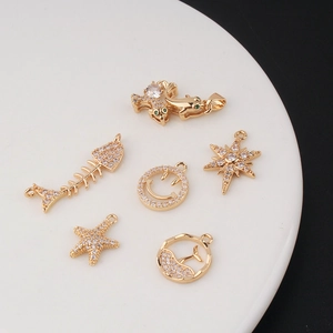 Gold-plated ocean charms with zircon inlays featuring starfish and dolphin shapes