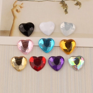 Macro shot of 12mm heart shaped faceted acrylic rhinestones in ten assorted colors
