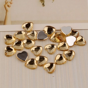 Flat back heart rhinestones in amber color with faceted surface for DIY crafts