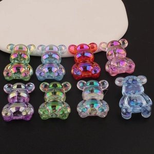 Detailed view of iridescent resin bear beads with aurora rainbow finish for DIY jewelry