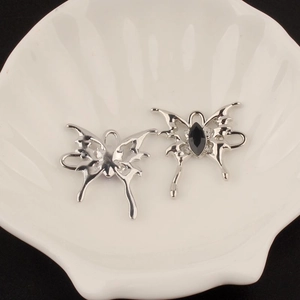 Gothic silver butterfly ear cuff with black marquise gem and liquid metal punk style