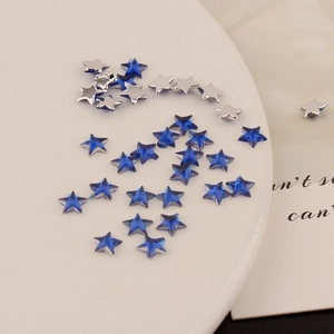 Detail of 6mm dark blue acrylic star rhinestones for DIY crafts and nail art design