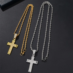 Iced out cross pendant necklaces in gold and silver with sparkling stones on rope chains