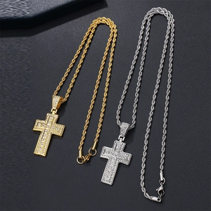 Hip hop jewelry set featuring gold and silver cross pendants with shimmering rhinestones