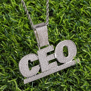 Hip-hop silver CEO letter pendant necklace with sparkling cubic zirconia on green grass