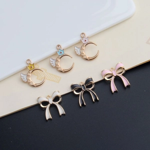 DIY jewelry charms set featuring enamel moon with crown and double bows in mixed colors