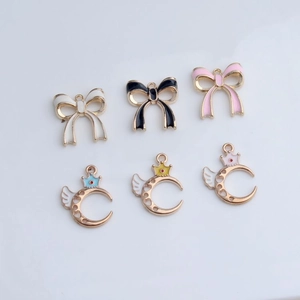 DIY jewelry set featuring alloy enamel bow and crescent moon crown pendants in assorted colors