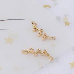 Detail view of gold leaf vine connectors with sparkling cubic zirconia for DIY jewelry