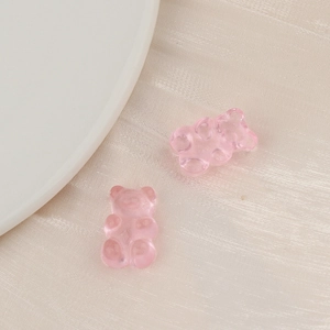 Macro shot of pink translucent resin gummy bears for DIY jewelry and hair accessories